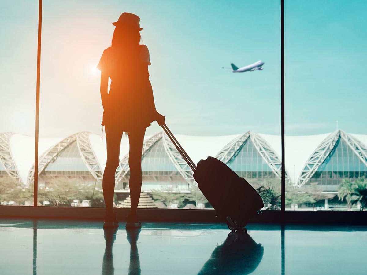 Woman at the airport with luggage