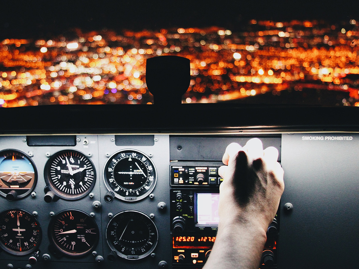 man using controls in plane