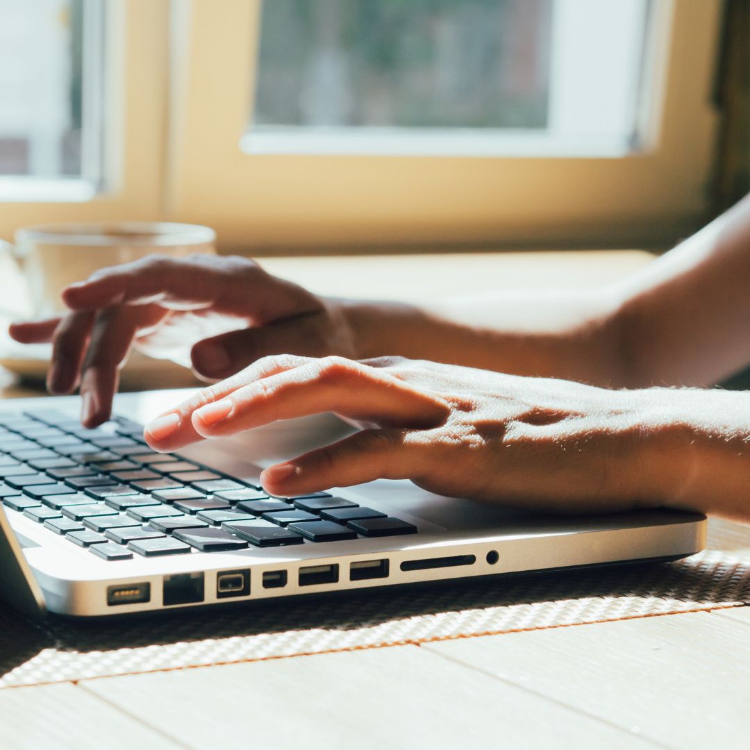Person's hands at keyboard