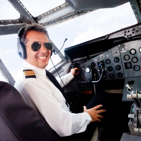 Pilot smiles from cockpit