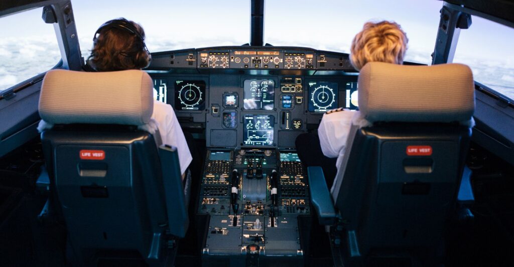 Pilot and co-pilot flying a commercial plane