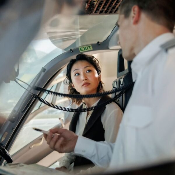 student listening to her flight instructor