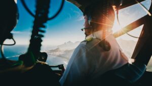 pilot and sunset in plane