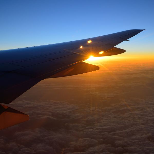 view of airplane wing mid-flight