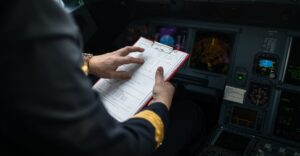pilot looking at clipboard