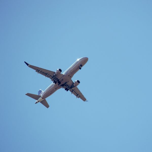 view of commercial plane flying