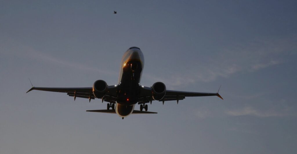 view of commercial plane flying